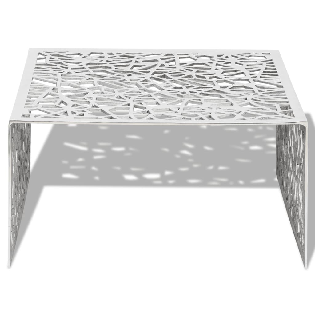 Mesa de centro con diseño geométrico calado aluminio plateado