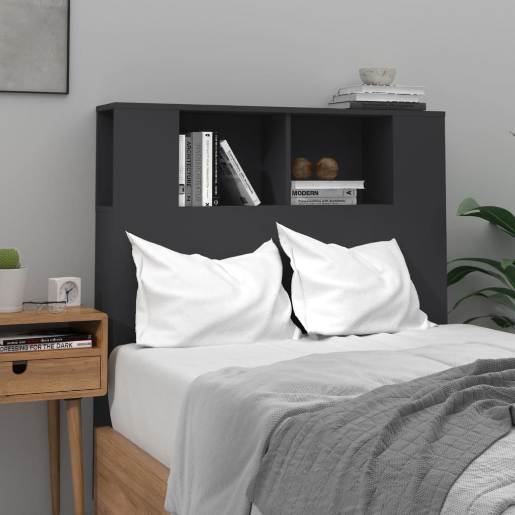 Modern black headboard with shelves for storage in a stylish bedroom setup, featuring white pillows and minimalist decor.