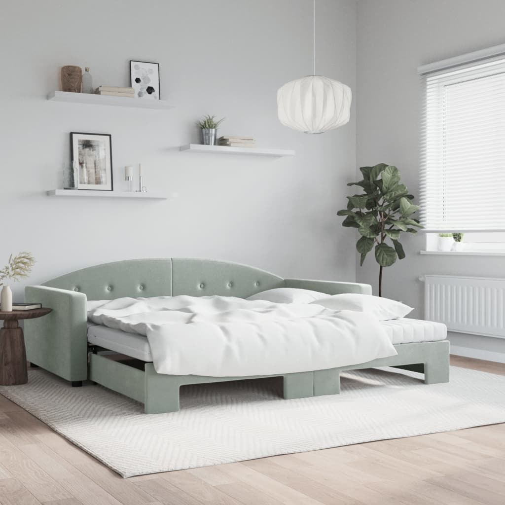 Sofá cama nido en color gris claro con colchón, ideal para salón o dormitorio, convertido en cama y decorado minimalista.