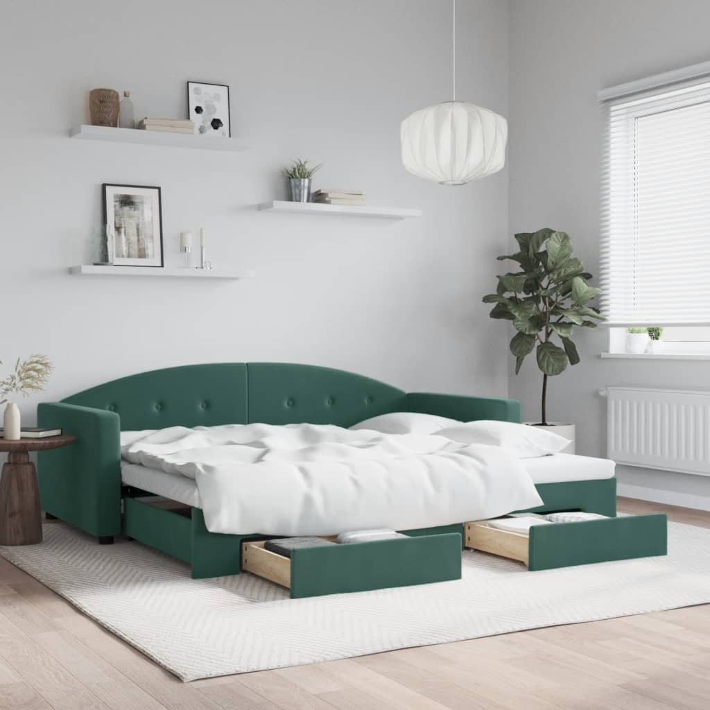 Sofá cama nido de terciopelo verde oscuro con cajones, estilo moderno y funcional en sala de estar elegante.