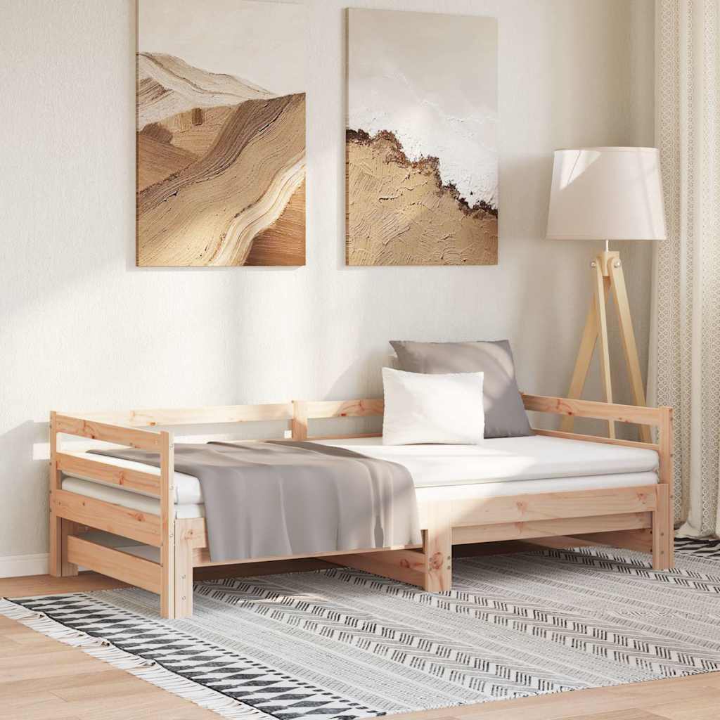 Sofá cama extraíble de madera de pino en un ambiente moderno, con almohadas y decoración elegante.