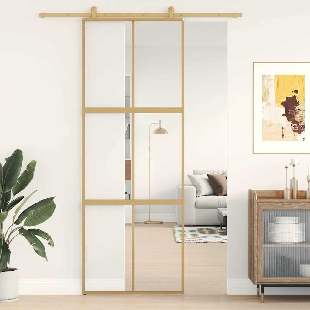 Golden sliding door made of transparent ESG glass and aluminum 