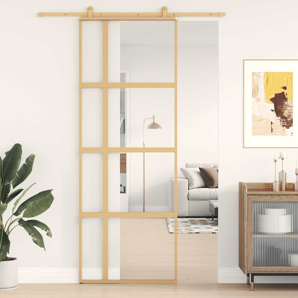 Gold sliding door made of transparent ESG glass and aluminum 