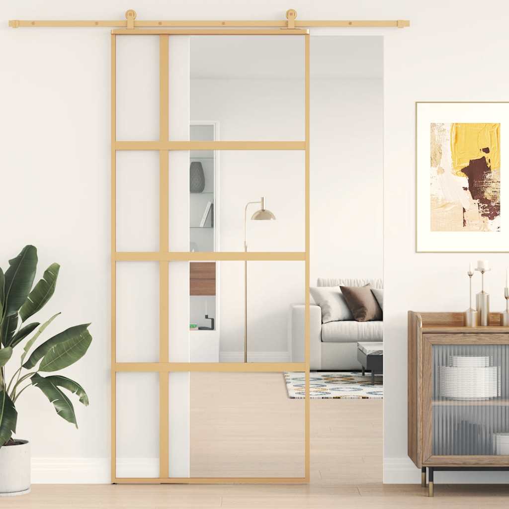 Golden sliding door made of transparent ESG glass and aluminum 