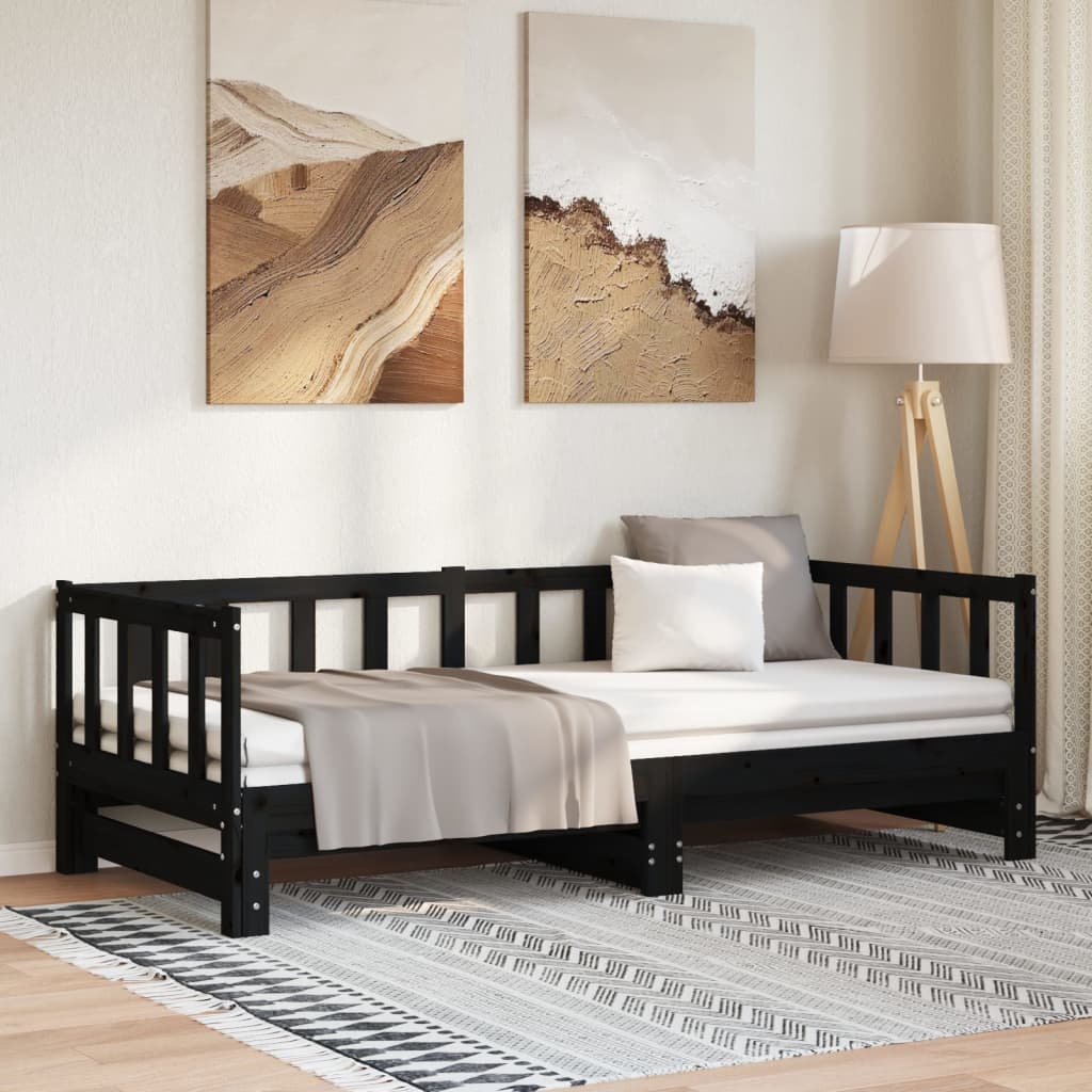 Sofá cama nido de madera maciza de pino negro en un elegante salón con arte moderno y lámpara.