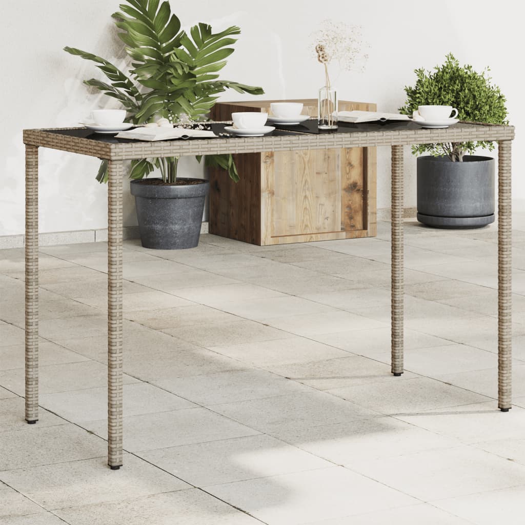 Vetonek Mesa de jardín superficie de vidrio ratán PE gris 115x54x74 cm