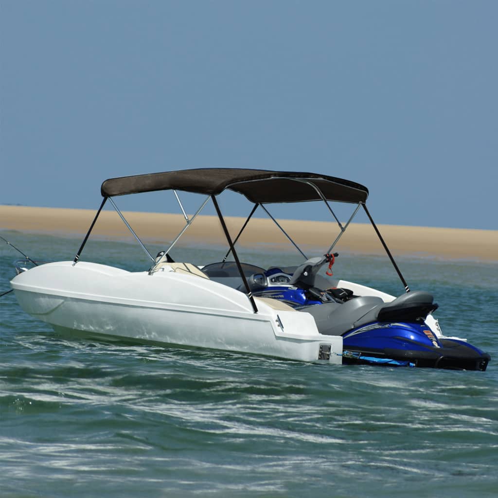 Bote con capota bimini negra navegando en aguas calmadas, ideal para protección solar.