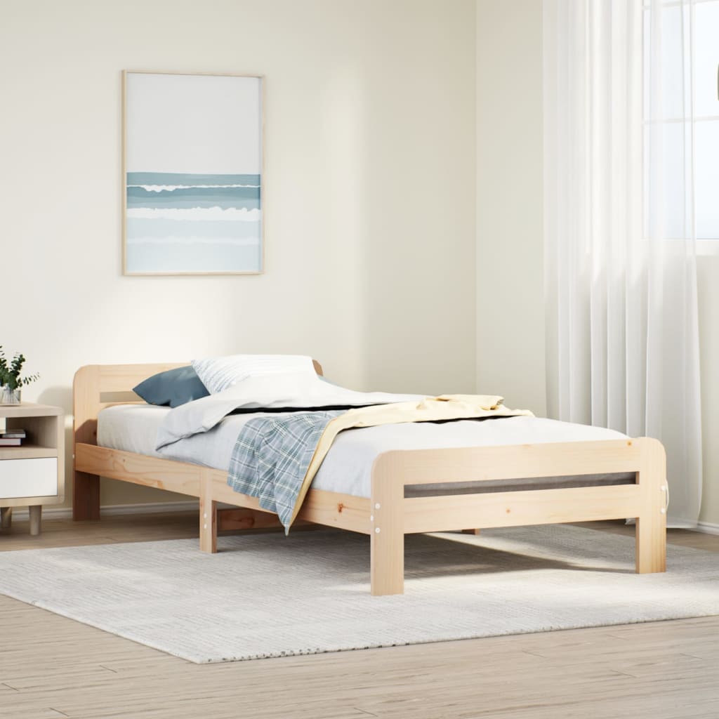 Estructura de cama de madera maciza de pino 90x200 cm en dormitorio moderno, con cabecero y estribo funcionales.