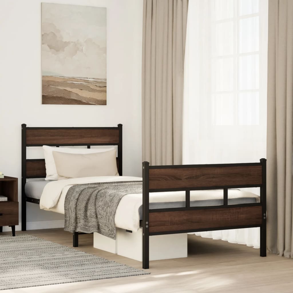 Estructura de cama marrón con cabecero y pie sin colchón en dormitorio moderno, acompañado de mantas y decoración minimalista.