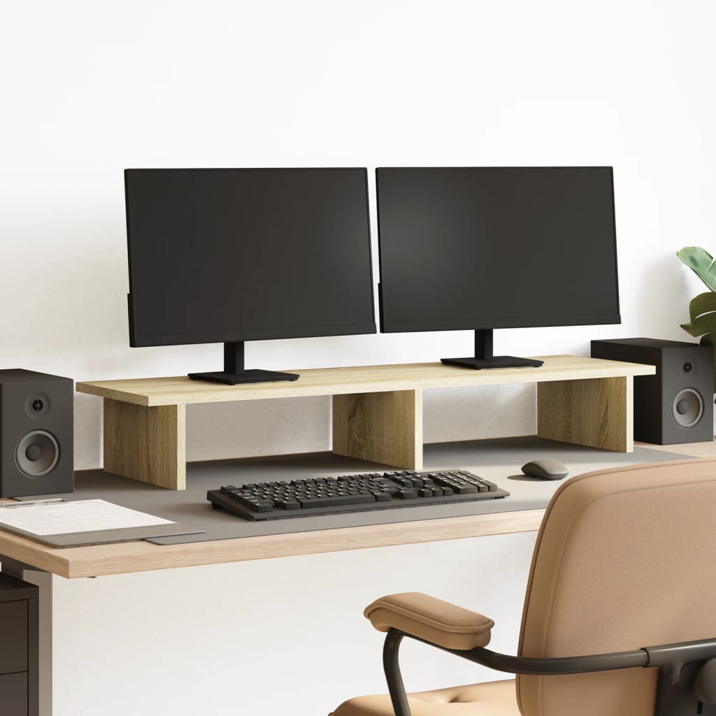 Soporte de pantalla de madera en un escritorio, con dos monitores y altavoces, ideal para mejorar el espacio de trabajo.