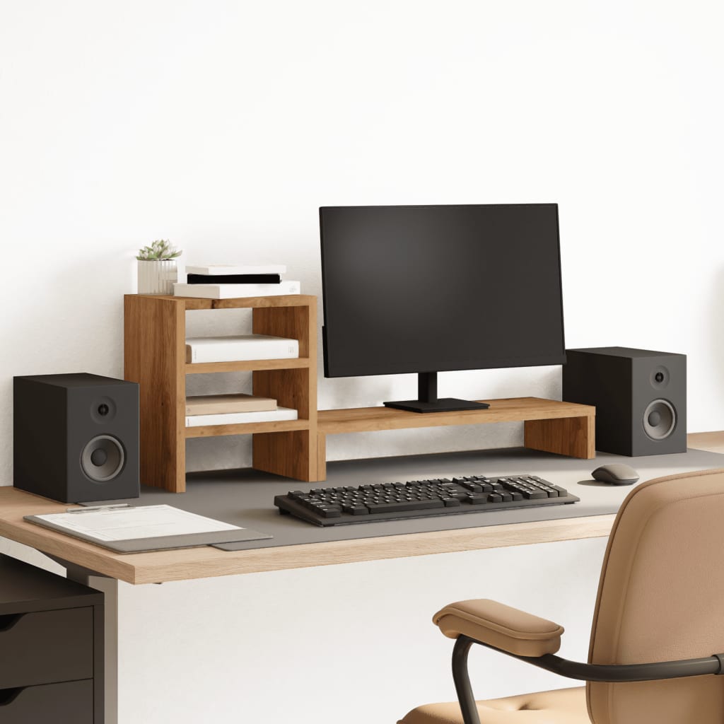 Soporte de monitor de madera con organizador y altavoces en un escritorio moderno y funcional.