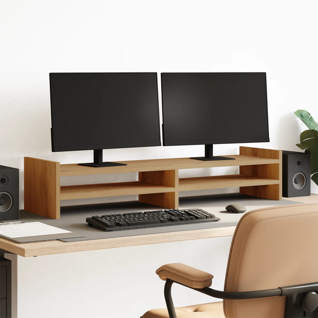 soporte de madera para monitores dobles en un escritorio moderno, con teclado y altavoces, mejorando la ergonomía de trabajo.