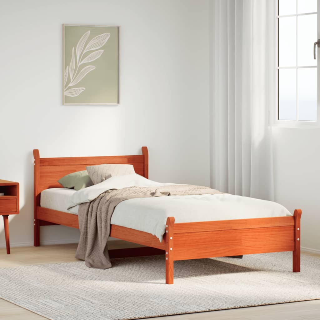 Estructura de cama de madera maciza marrón 90x190 cm en un acogedor dormitorio con decoraciones minimalistas.