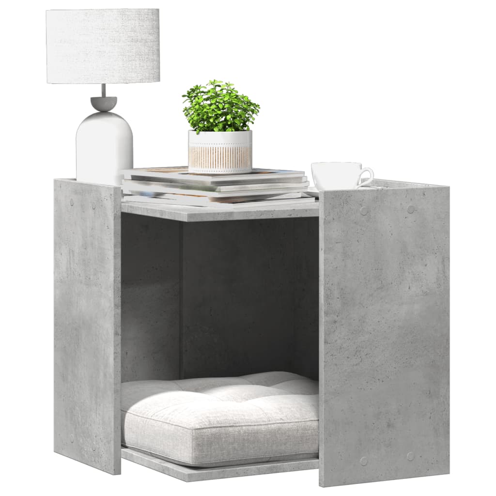 Mueble arenero de gatos en hormigón gris con diseño moderno y acogedor espacio interior para gatos.