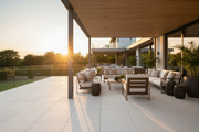 Terraza cubierta pavimentada con Losa Medinaceli de hormigón en blanco con muebles de exterior - Vetonek