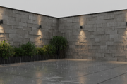 Esquina de muro urbano rematada con Piedras de Angulo Poblet en una terraza moderna bajo lluvia suave